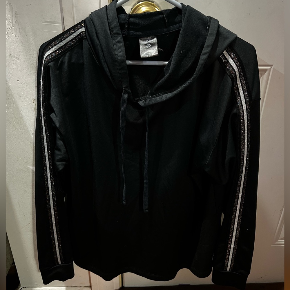 A light black hoodie. Size 1X. Has glitter strips on both arms. Pro player brand